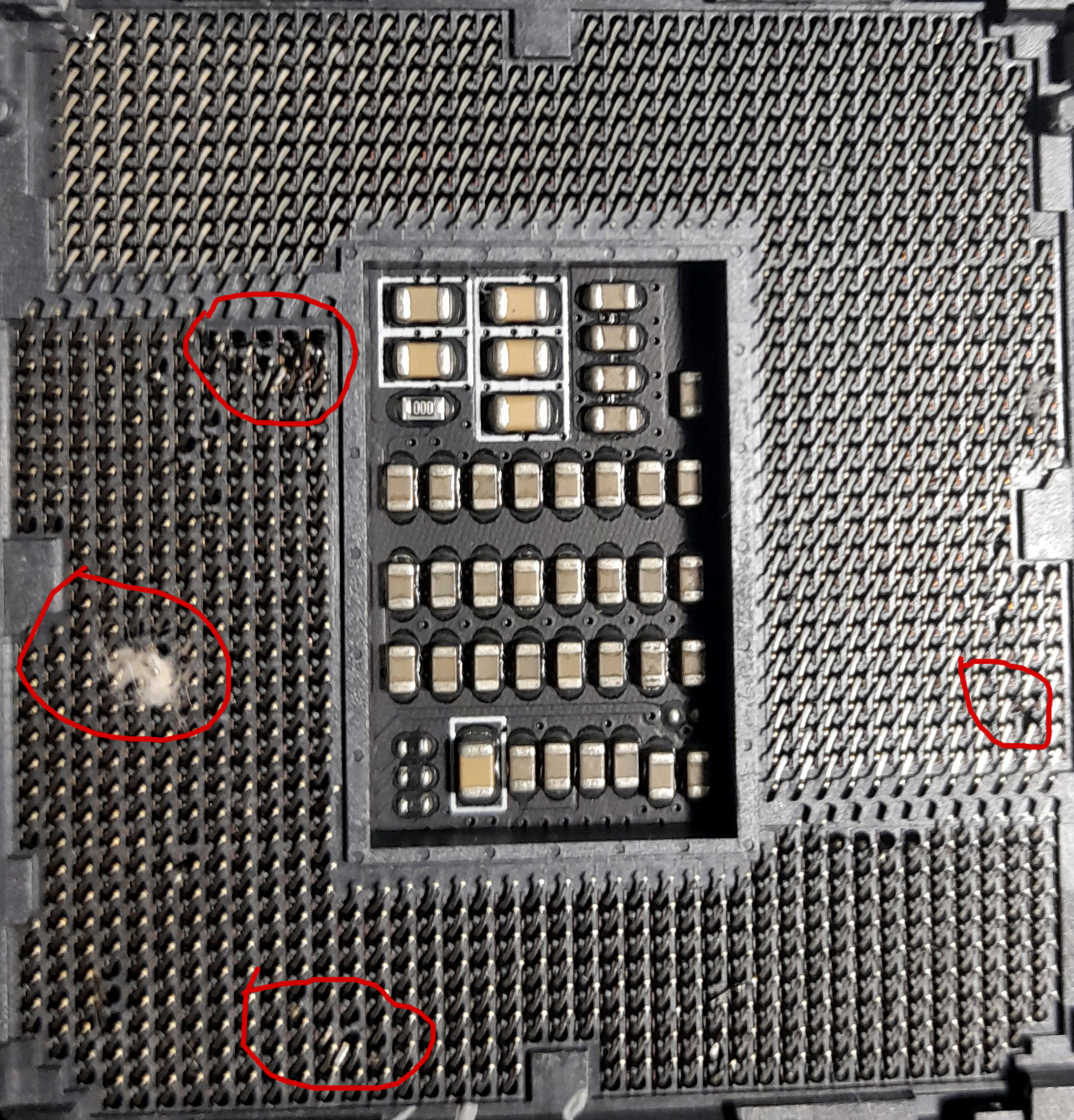 lga 1700 socket has thermal paste and possibly bent pins. is it